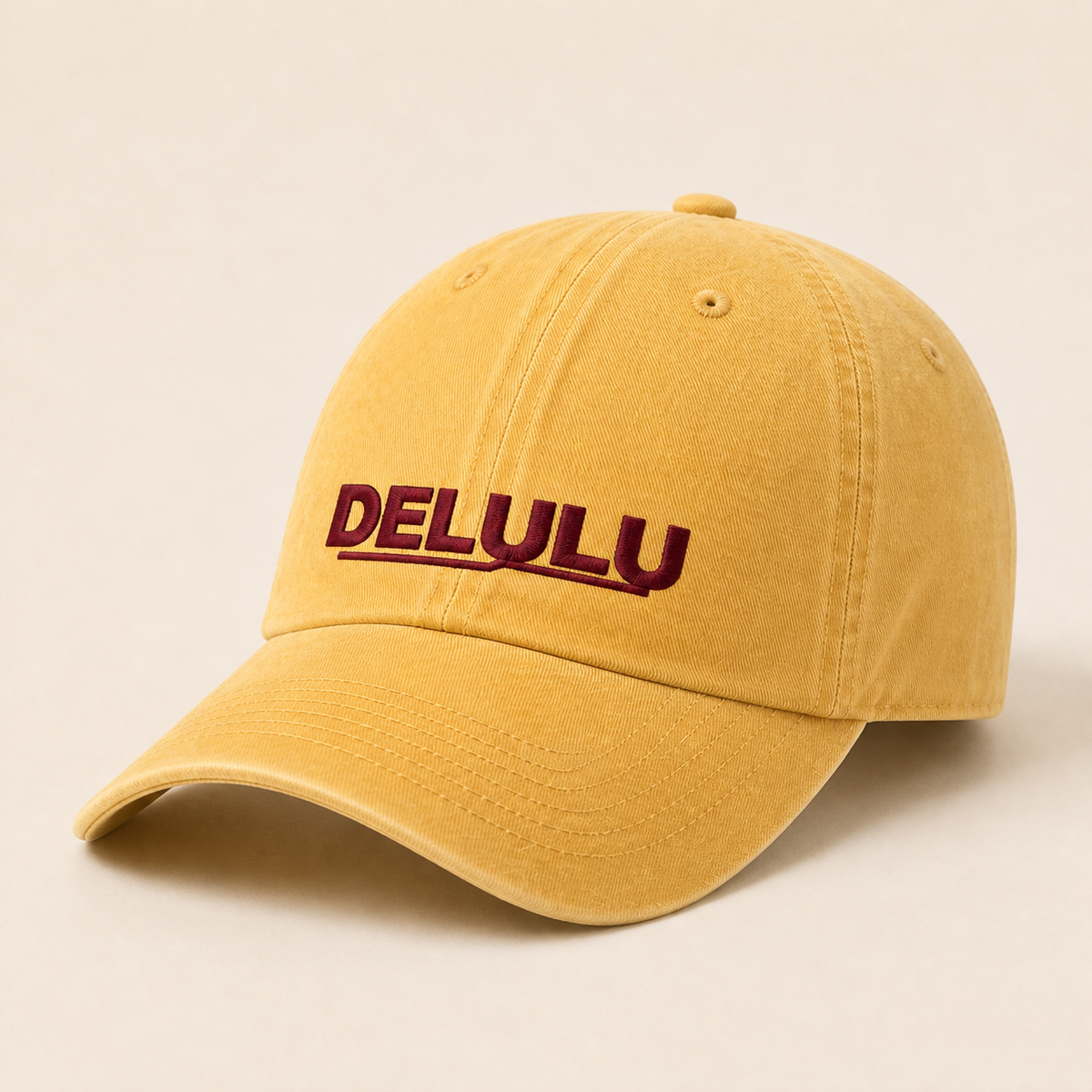 DELULU wordmark washed pale yellow cap, three-quarter view
