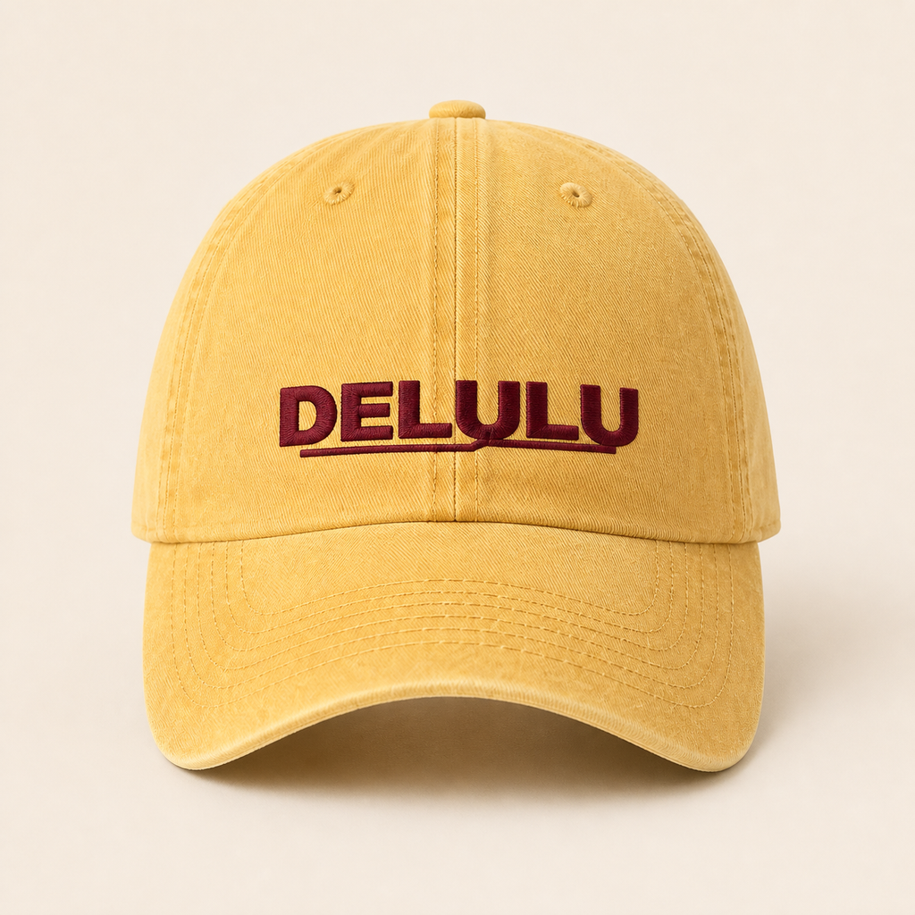 DELULU wordmark washed pale yellow cap, front