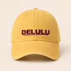 DELULU wordmark washed pale yellow cap, front