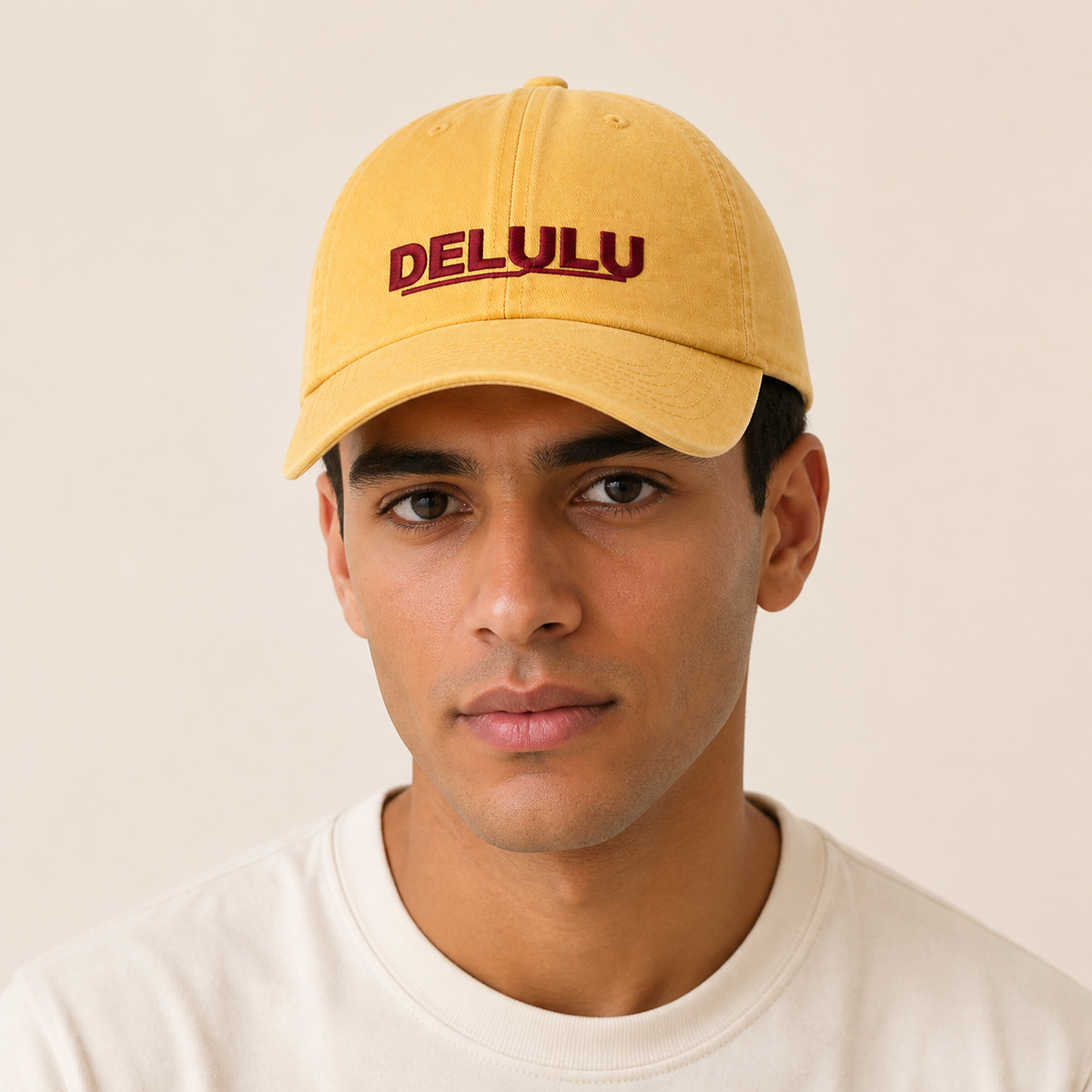 DELULU wordmark washed pale yellow cap worn on head