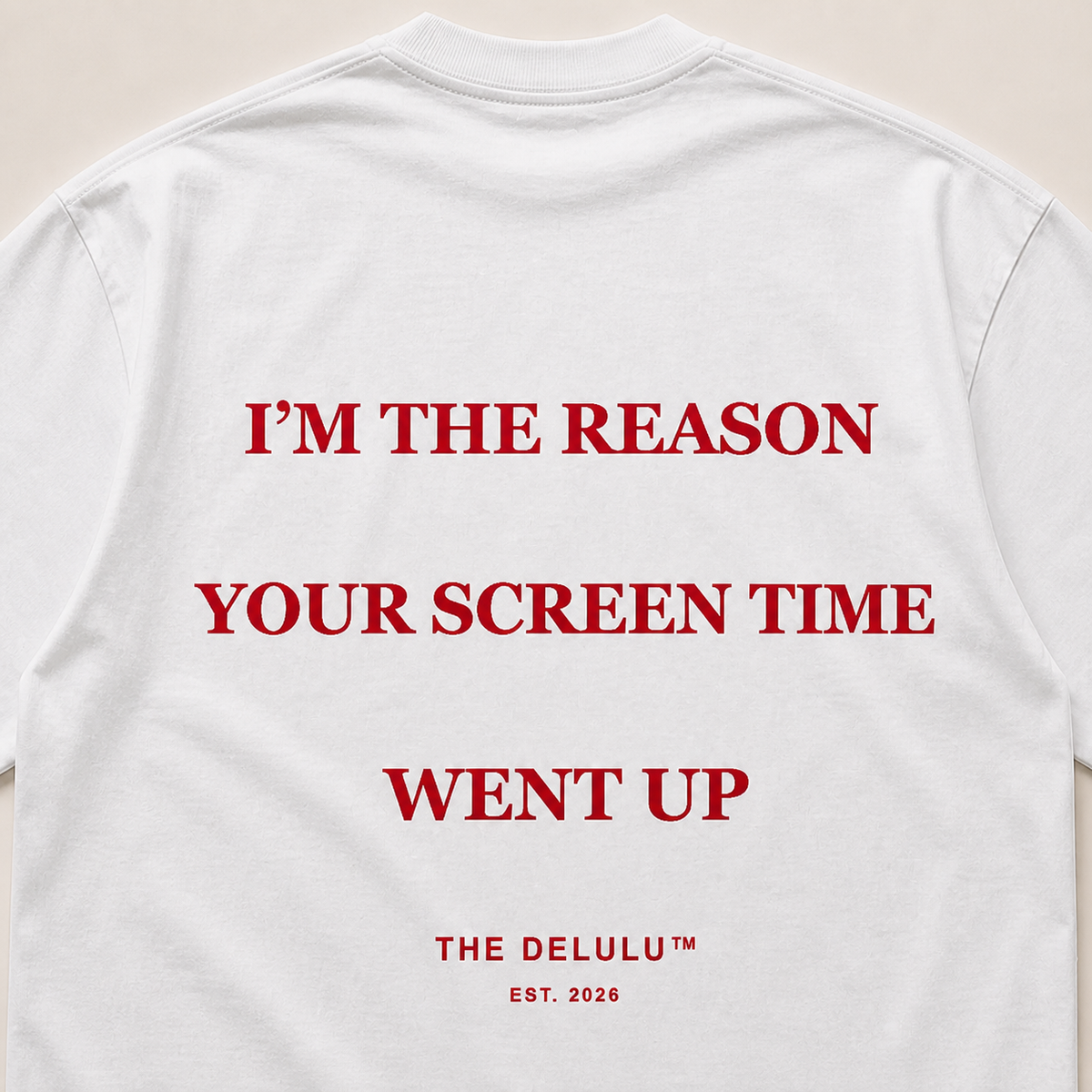 Close-up of rich red Screen Time back print on white cotton