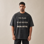 Washed charcoal The Plan Was Never Realistic Tee worn from the front